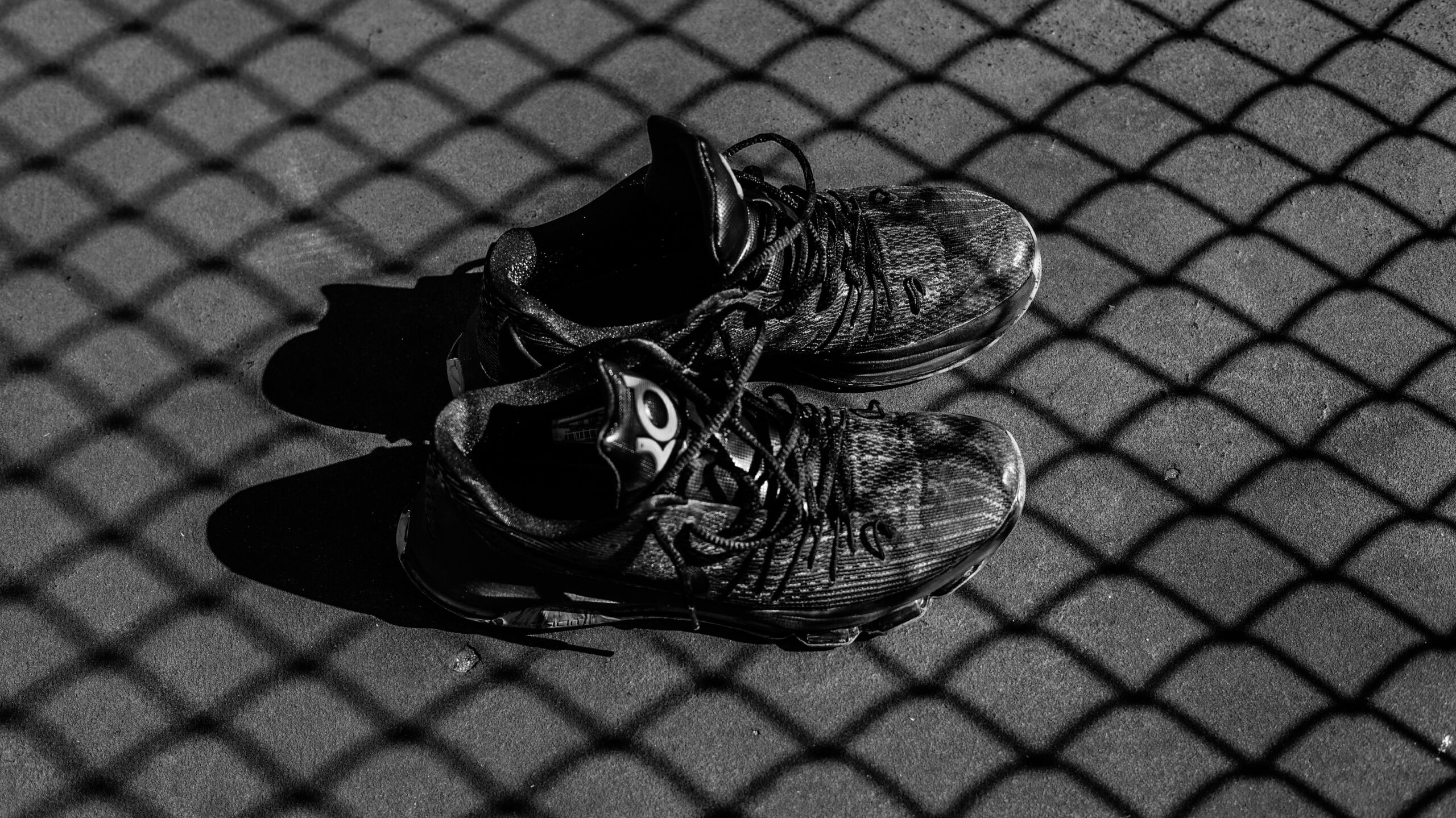 Your next great race starts here. Black and white photo of running shoes.
Photo by Skye Studios on Unsplash